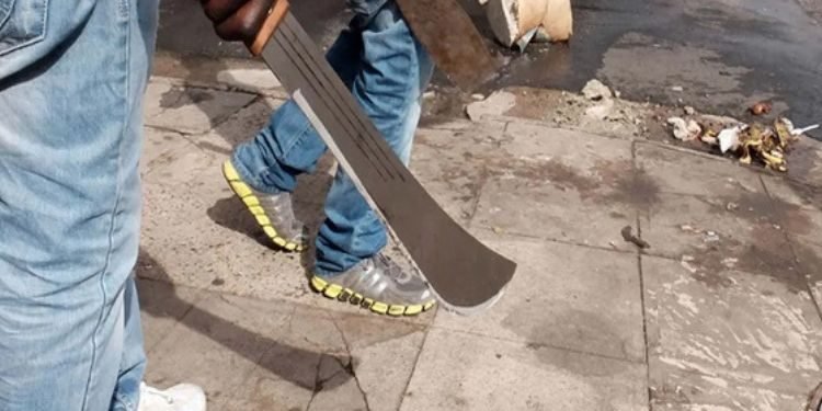 Cultists holding machetes.