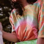 Lady wearing Adire textile material tee