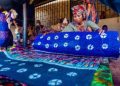 Woman trading in Adire textile material