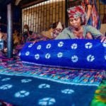 Woman trading in Adire textile material