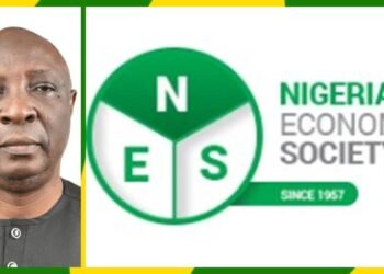 Professor Adeola Adenikinju besides Nigerian Economic Society (NES)'s logo.