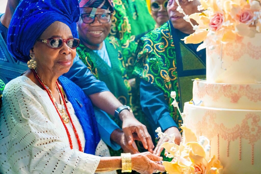 Beautiful moment of joy as Mama Victoria Olaitan Abiodun cuts her 90th birthday cake surrounded by family and friends.